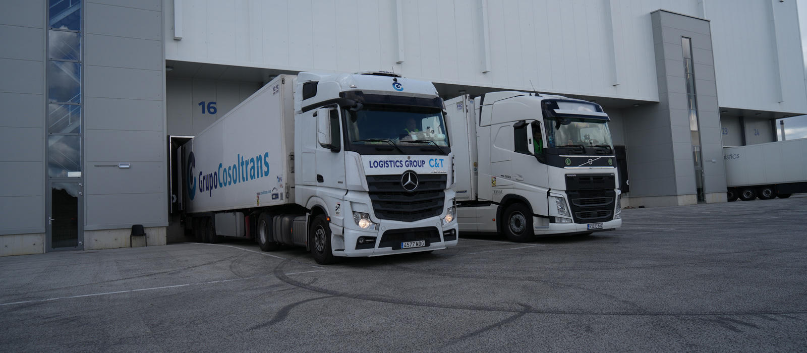 Fleet of lorries outside of distribution warehouse